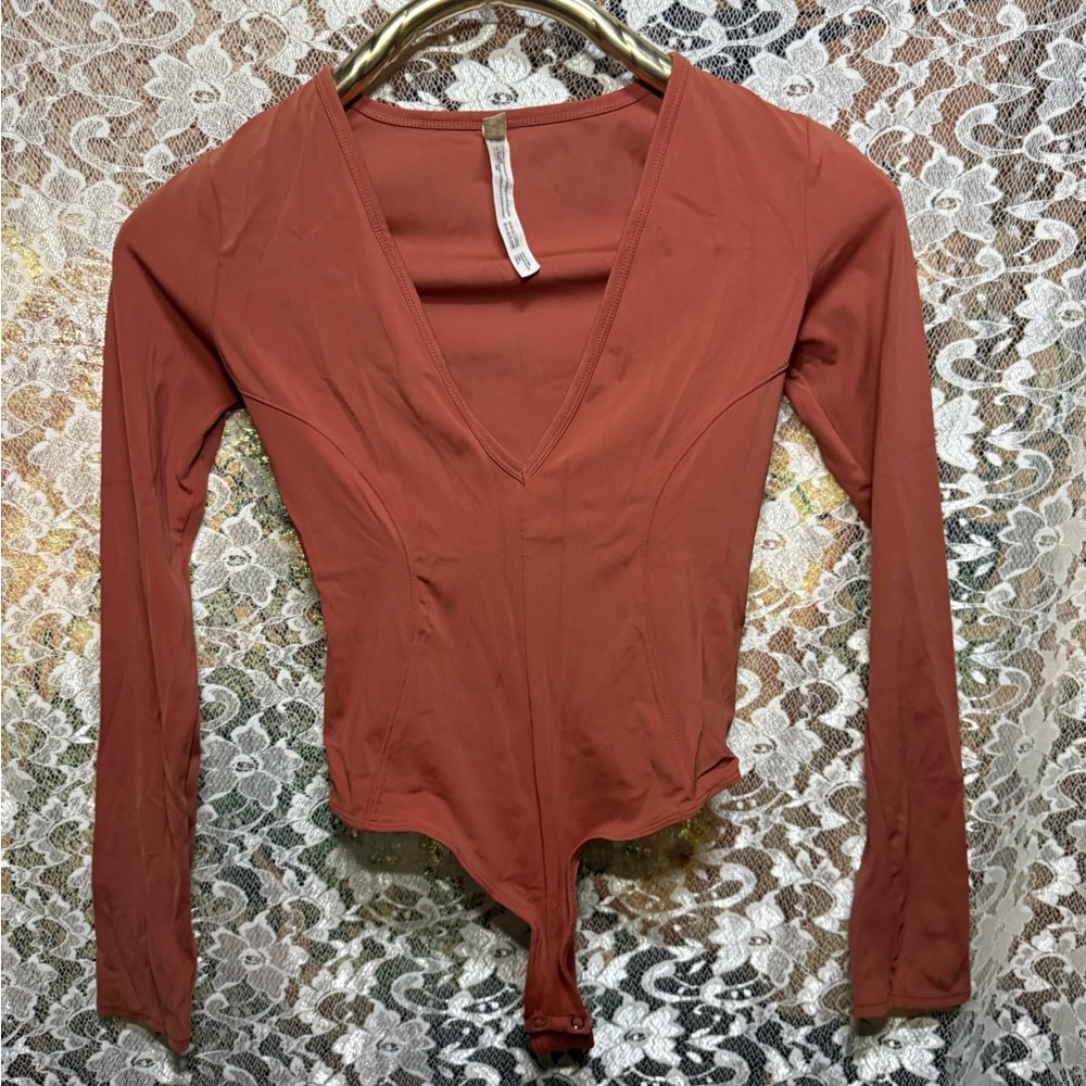 Free People Rust orange deep V-Neck thong Bodysuit snap crotch small long slv